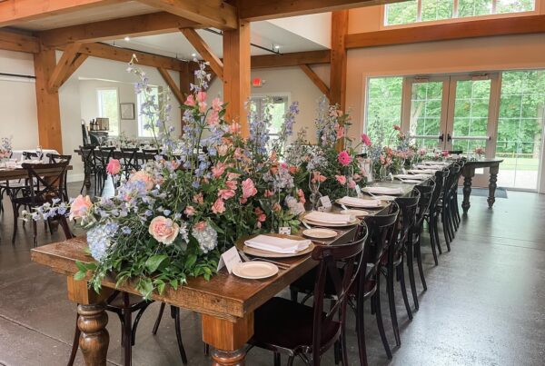 Table set for wedding, with full floral runner