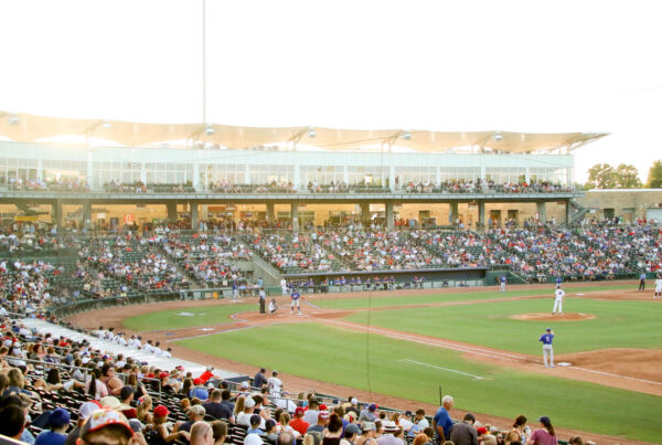 NWA on the field in front of the crowd at Arvest Ballpark