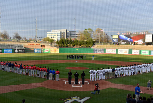 Teams stand on lines at the beginning of the game