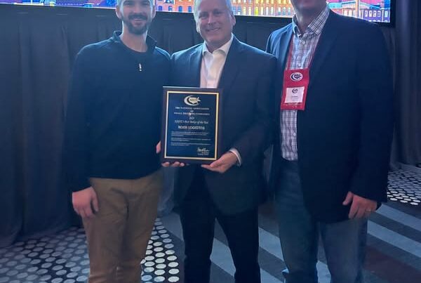 ROAR associates hold plaque