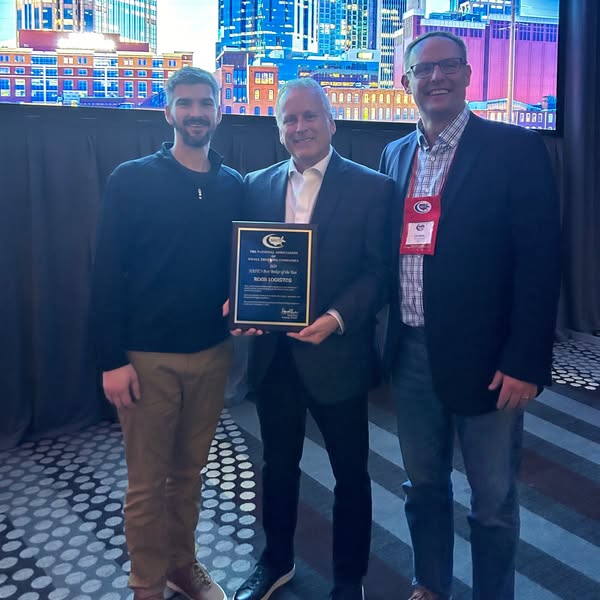 ROAR associates hold plaque