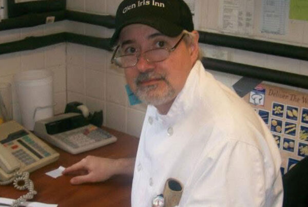 Richard Robinson looks at the camera from his desk