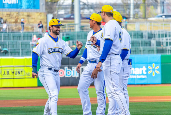 NWA players stand together on the field
