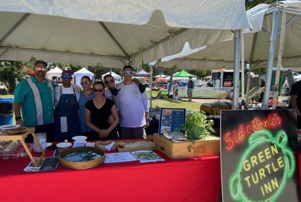associates from REG's Florida restaurants with their table at Taste of Islamorada