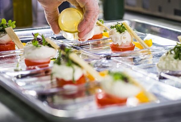Associate prepares hors d'oeuvres