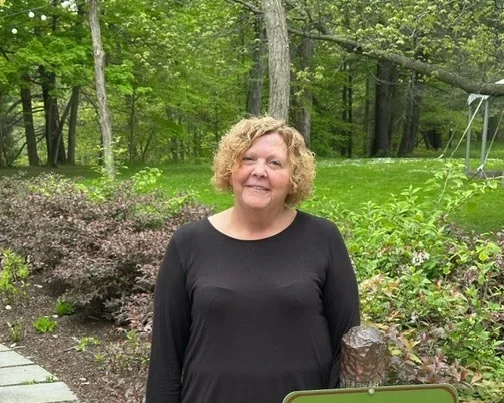 Denise Coffey in the courtyard at Glen Iris Inn