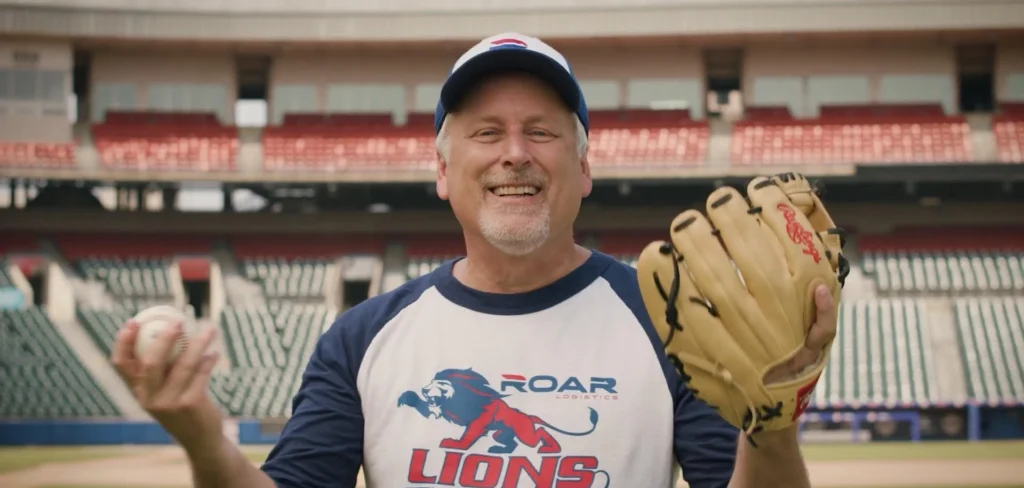 Bob Rich III smiles before throwing a first pitch
