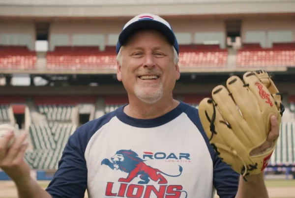 Bob Rich III smiles before throwing a first pitch