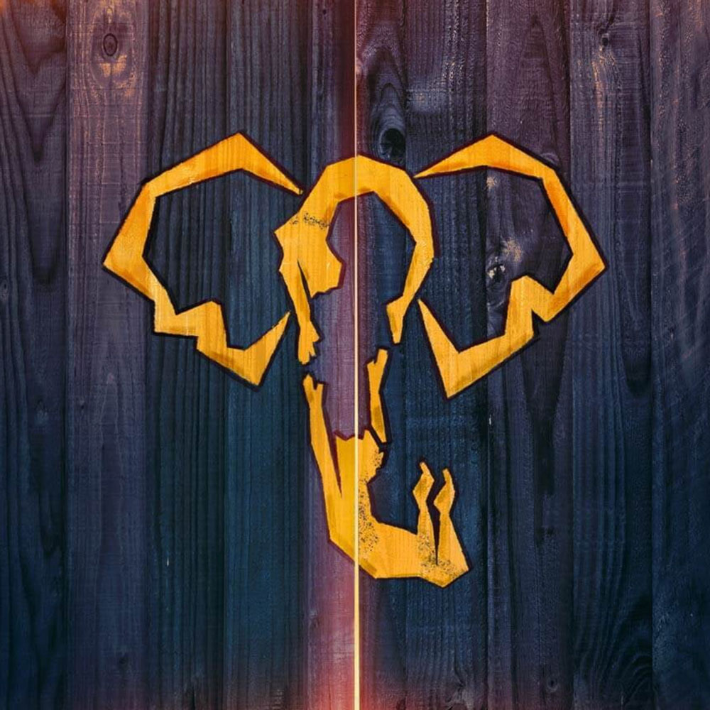 elephant head outline against a wood grain background